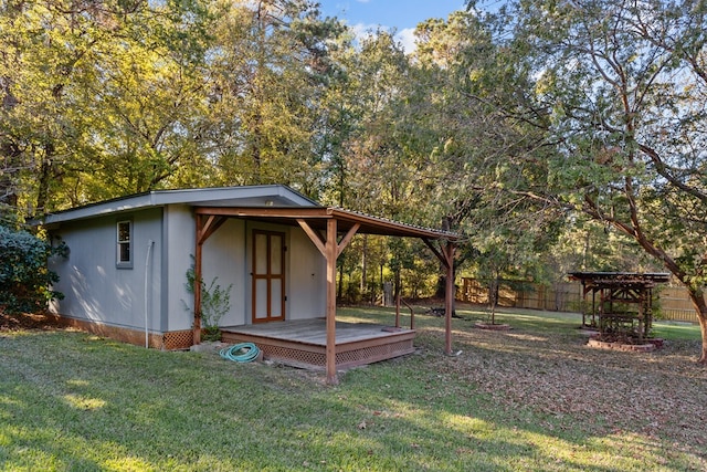 view of outbuilding with a yard