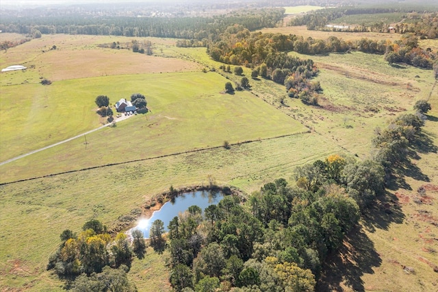 birds eye view of property with a water view and a rural view
