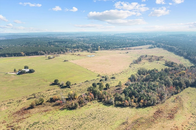 drone / aerial view featuring a rural view and a wooded view