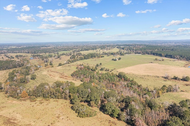 drone / aerial view featuring a view of trees