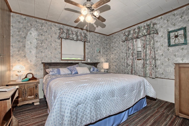 bedroom with ceiling fan and crown molding