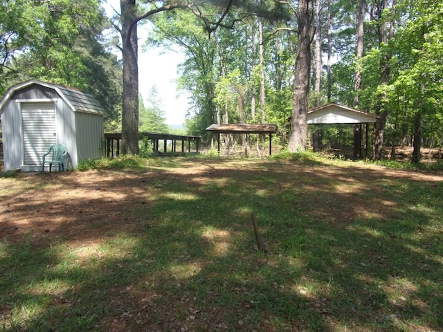 428 Holiday Cir, Hemphill, TX 75948 - view of yard featuring a storage shed, a detached carport, a gazebo, and an outdoor structure