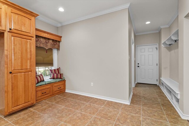 mudroom featuring tile patterned flooring and crown molding