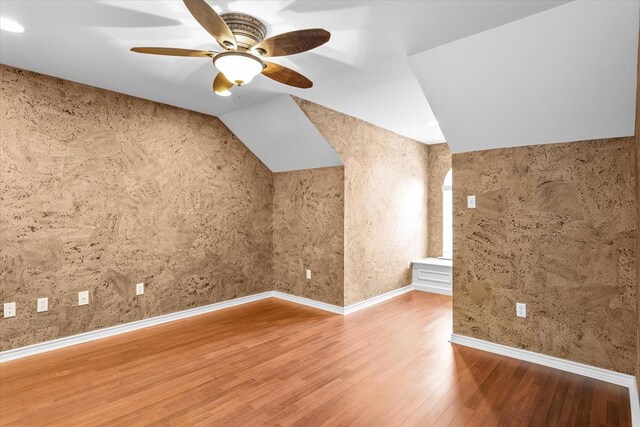 additional living space featuring hardwood / wood-style floors and ceiling fan