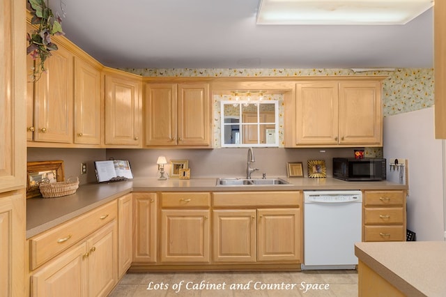 229 Thornton Rd, Huntington, TX 75949 - kitchen featuring white dishwasher, a sink, black microwave, light brown cabinets, and light countertops