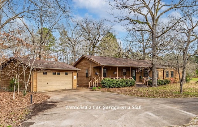 229 Thornton Rd, Huntington, TX 75949 - single story home with covered porch, driveway, and a garage