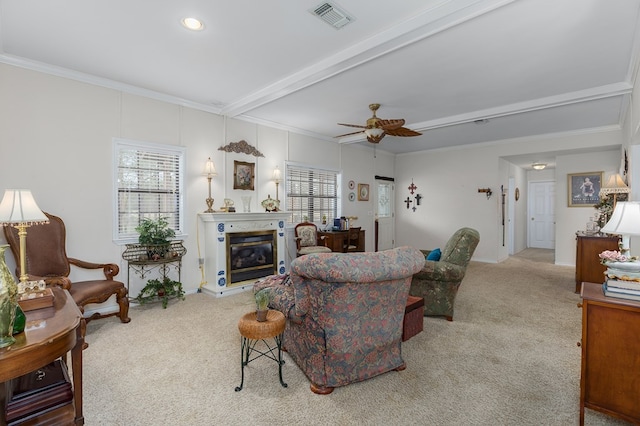 229 Thornton Rd, Huntington, TX 75949 - living room featuring carpet flooring, ornamental molding, a ceiling fan, a glass covered fireplace, and beam ceiling