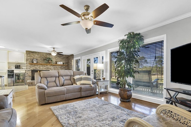 2528 Sam Rayburn Pkwy, Brookeland, TX 75931 - living area with ceiling fan, light wood finished floors, and crown molding