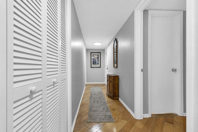 corridor with light hardwood / wood-style floors