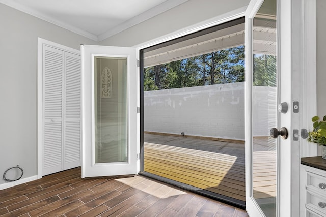 doorway to outside with french doors, dark hardwood / wood-style floors, and ornamental molding