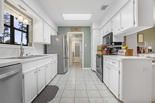 kitchen featuring white cabinets and stainless steel appliances