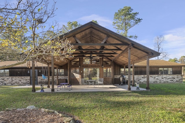 back of house featuring a yard and a patio area