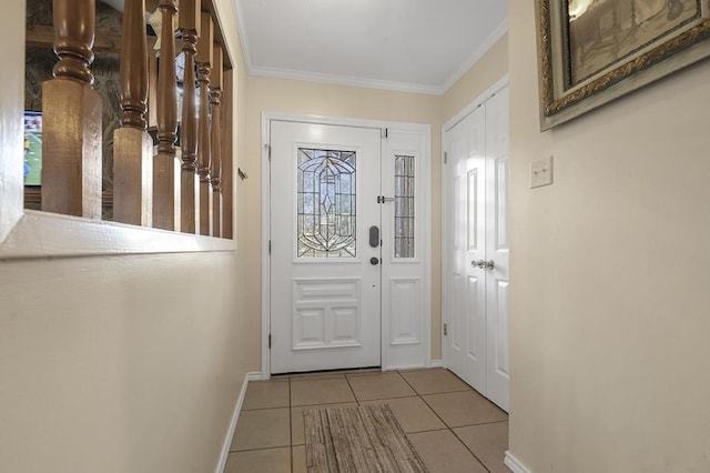 entryway featuring light tile patterned floors and crown molding