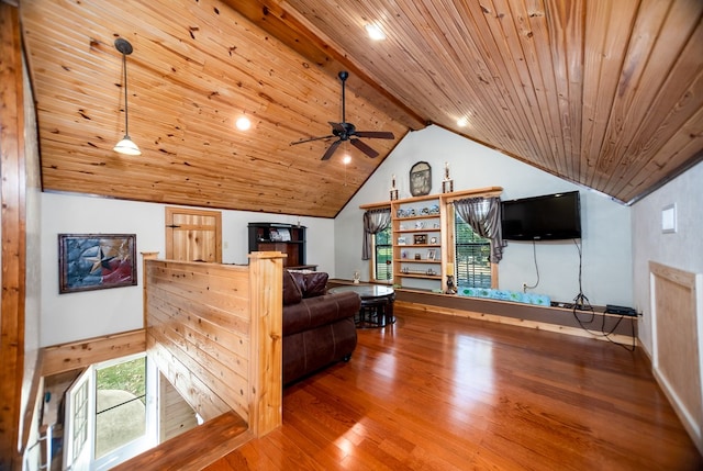 living room with ceiling fan, hardwood / wood-style floors, beamed ceiling, and wooden ceiling