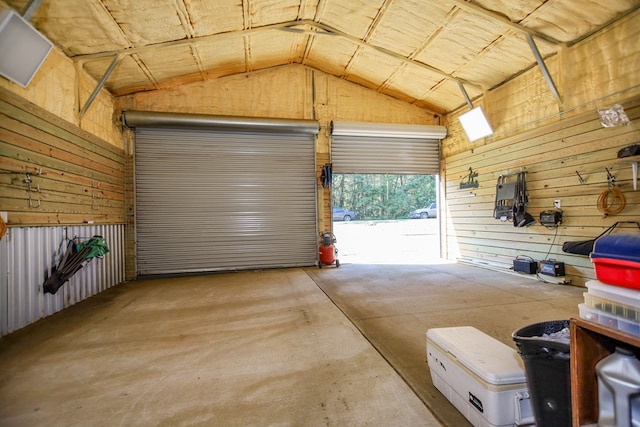 garage featuring wood walls