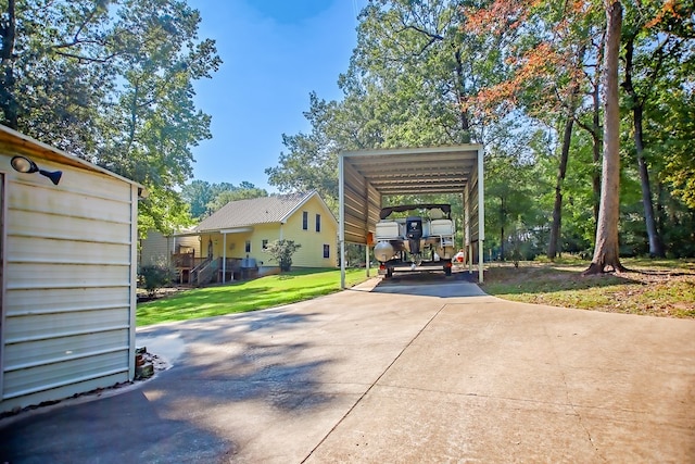 view of parking featuring a yard and a carport