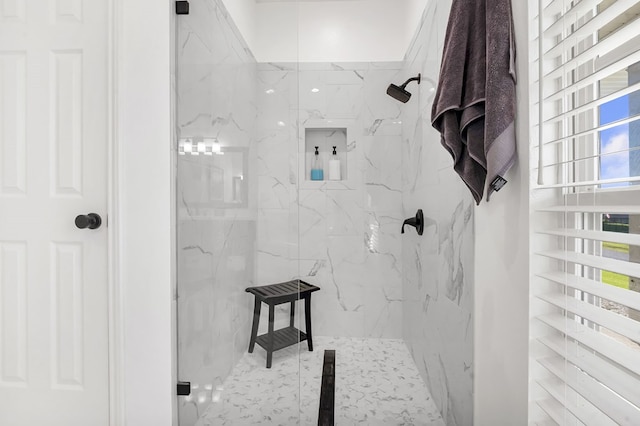 bathroom featuring a tile shower