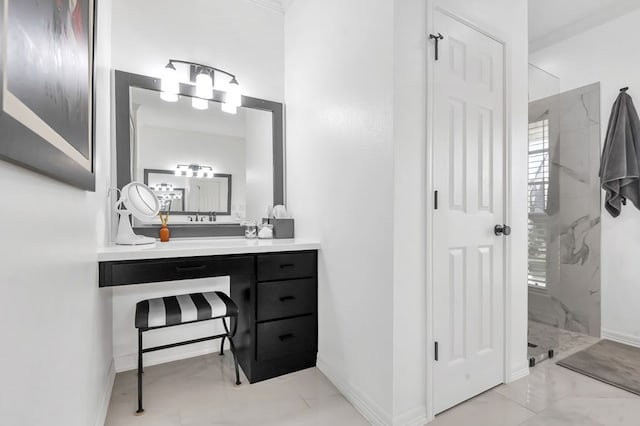 bathroom featuring vanity and tiled shower