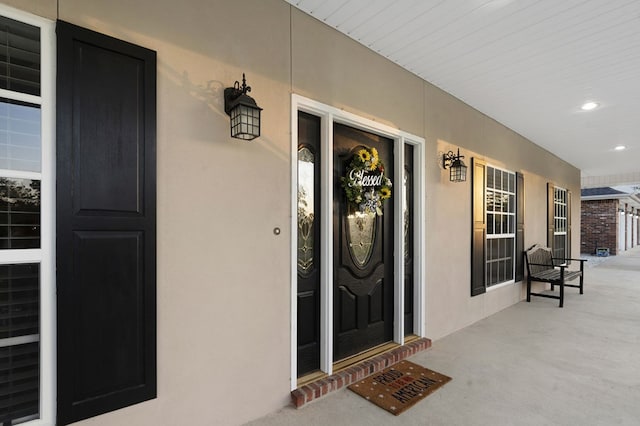 doorway to property featuring a porch