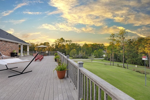 deck at dusk with a yard