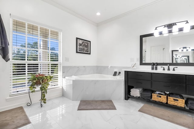 bathroom featuring vanity, crown molding, and tiled tub