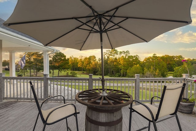 patio terrace at dusk featuring a deck