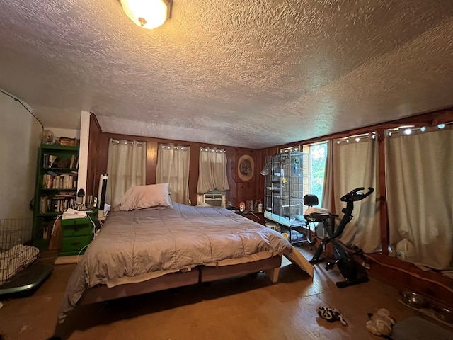 bedroom featuring hardwood / wood-style floors and a textured ceiling