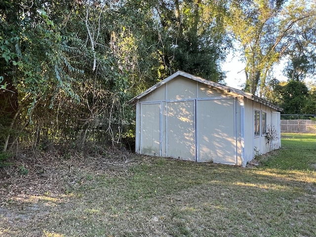 view of outdoor structure with a lawn