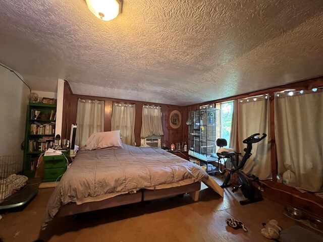 dining area with crown molding, ceiling fan, dark wood-type flooring, and wood walls