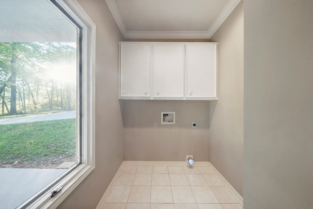 laundry room featuring electric dryer hookup, light tile patterned flooring, ornamental molding, and hookup for a washing machine