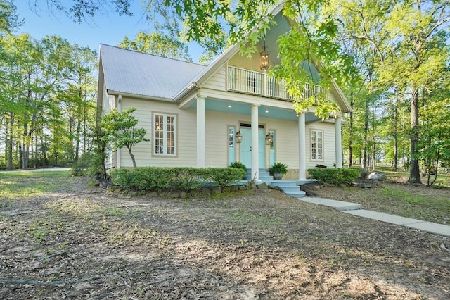 245 Shadow Dr, Hemphill, TX 75948 - view of front facade with a porch, a balcony, and metal roof
