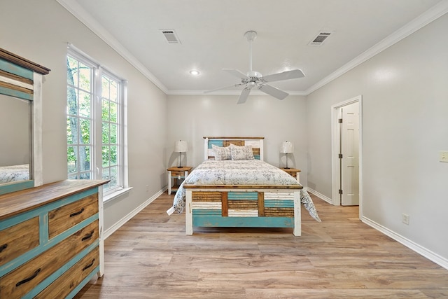 bedroom with ceiling fan, light hardwood / wood-style floors, and ornamental molding