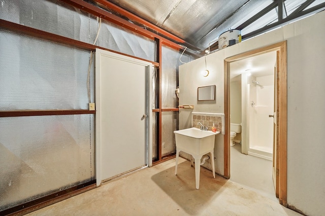 245 Shadow Dr, Hemphill, TX 75948 - full bathroom featuring concrete flooring, toilet, and a shower