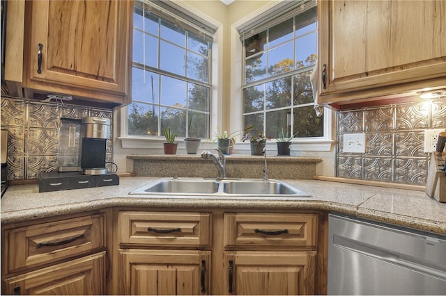 kitchen with dishwasher, decorative backsplash, a wealth of natural light, and sink