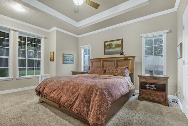 carpeted bedroom featuring ceiling fan and ornamental molding