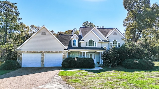 front facade featuring a front yard and a garage