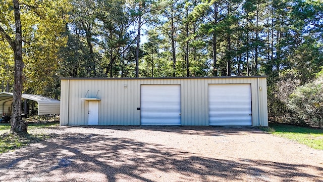 garage featuring a carport