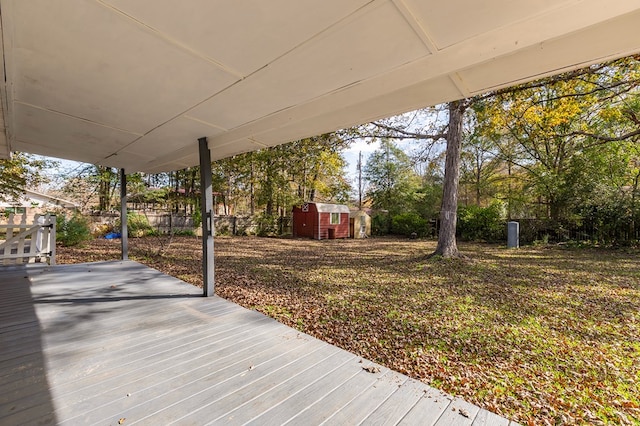 wooden terrace featuring a storage shed