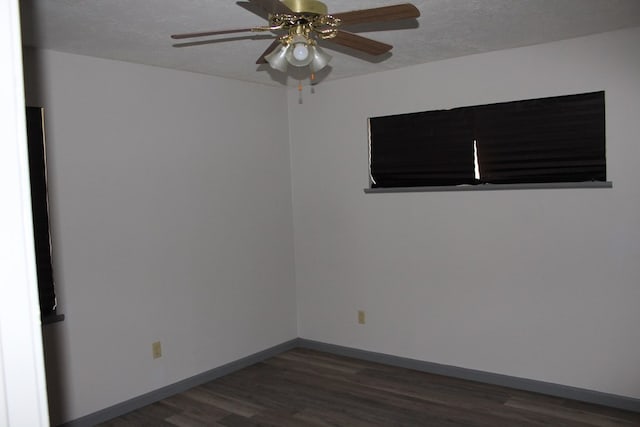 unfurnished room with a textured ceiling, baseboards, ceiling fan, and wood finished floors