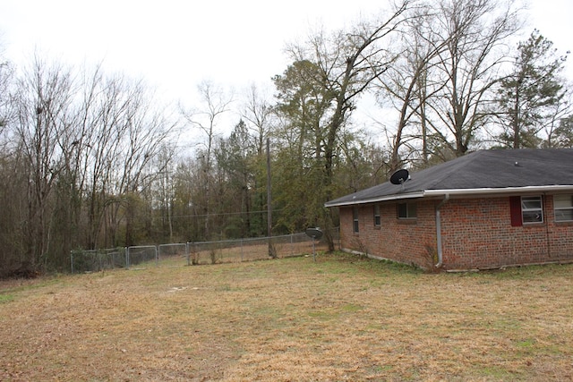 view of yard featuring a gate and fence