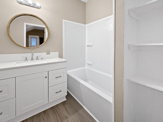 4124 N US Highway 96, Jasper, TX 75951 - full bathroom with vanity, wood finished floors, and bathtub / shower combination