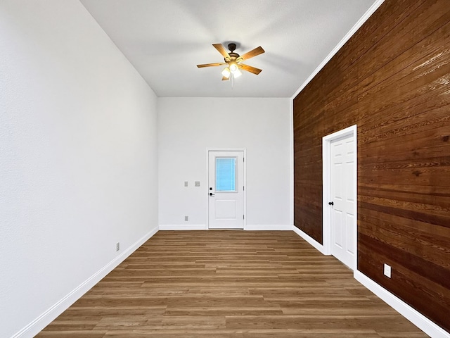 4124 N US Highway 96, Jasper, TX 75951 - empty room featuring ceiling fan, wooden walls, and wood finished floors