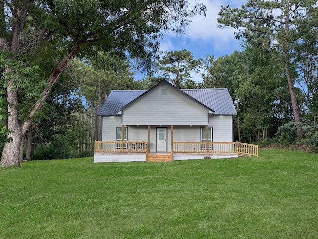 4124 N US Highway 96, Jasper, TX 75951 - rear view of house featuring a lawn, a wooden deck, and a metal roof
