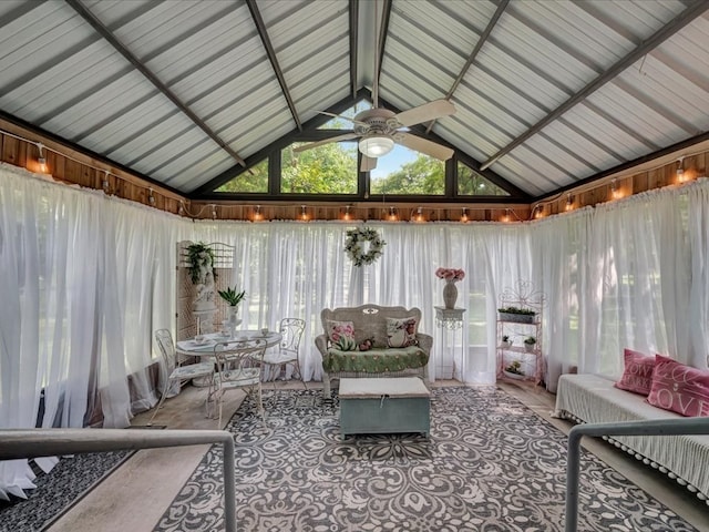 sunroom with ceiling fan and vaulted ceiling