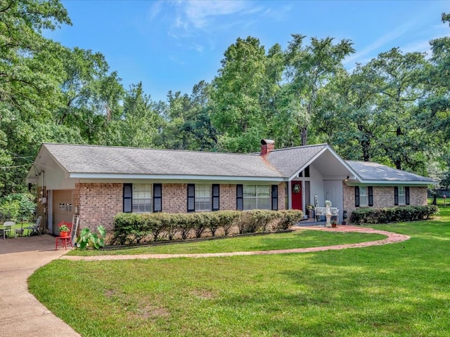 single story home with driveway, a front lawn, an attached garage, brick siding, and a chimney