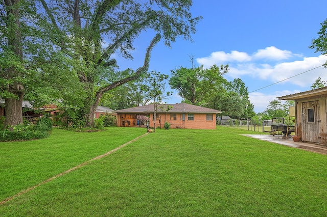 view of yard with a patio area and fence
