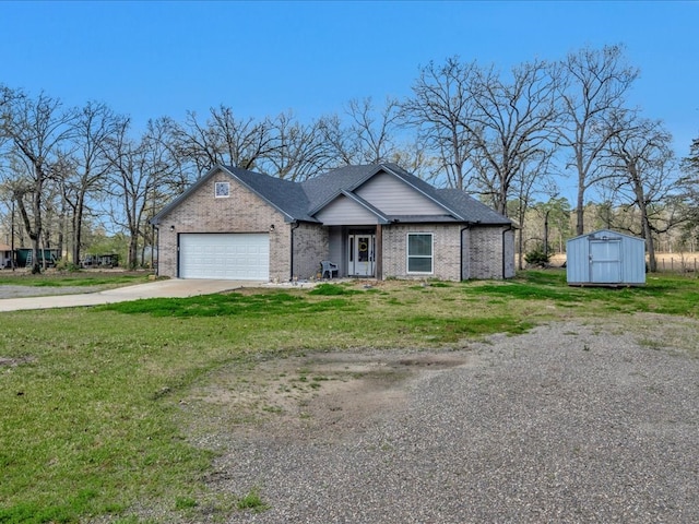 view of front facade with concrete driveway, an attached garage, a front lawn, and a shed