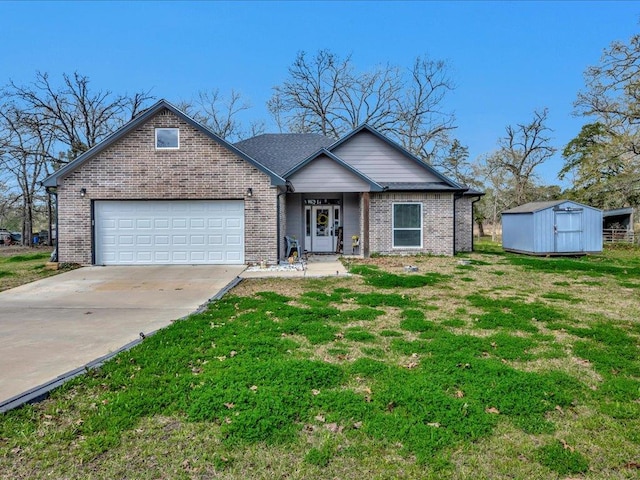 view of front of house featuring brick siding, a front lawn, an attached garage, and driveway