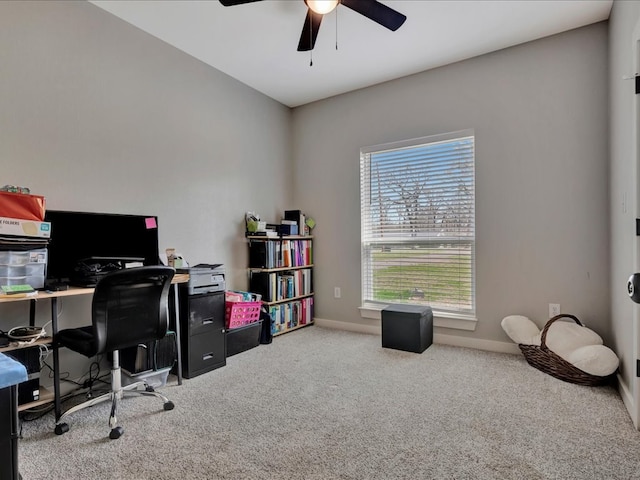 office with carpet flooring, baseboards, and a ceiling fan