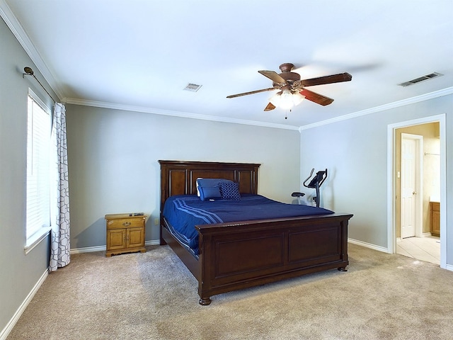 carpeted bedroom with ensuite bath, ceiling fan, and crown molding